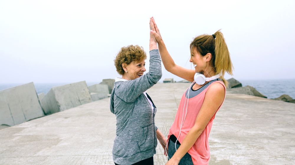 Female friends high fiving