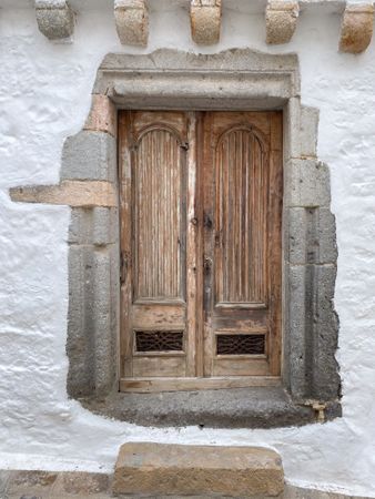 Patmian wood door with ireon vents