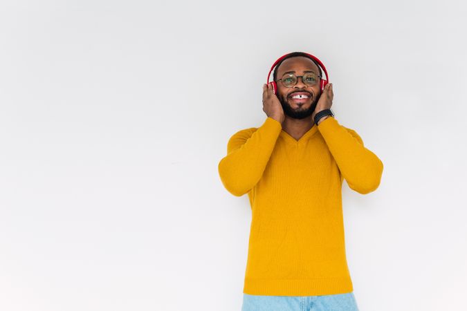 Black man listening to music in headphones
