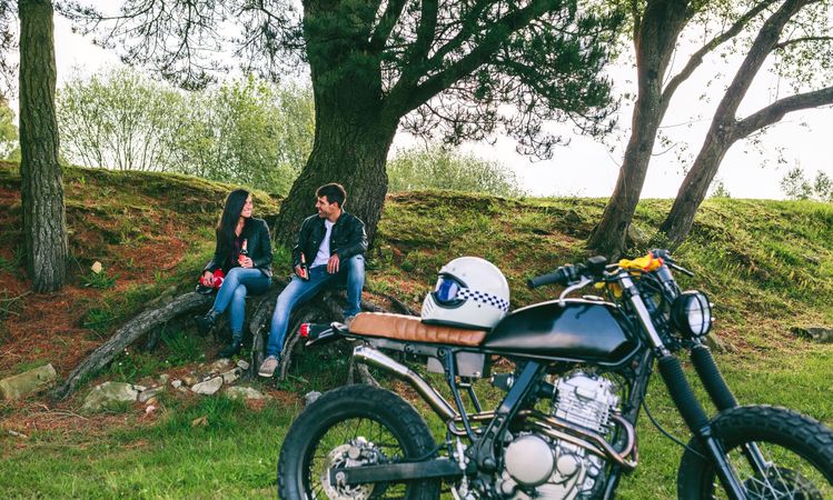 Couple resting from a motorcycle trip