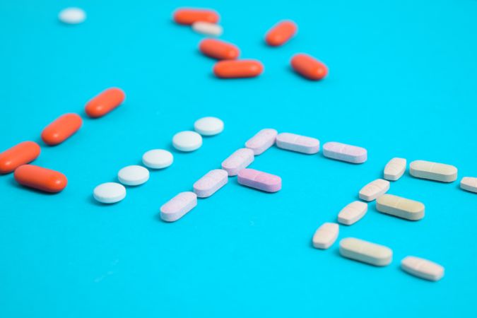 Close up of different pills making the word "LIFE"