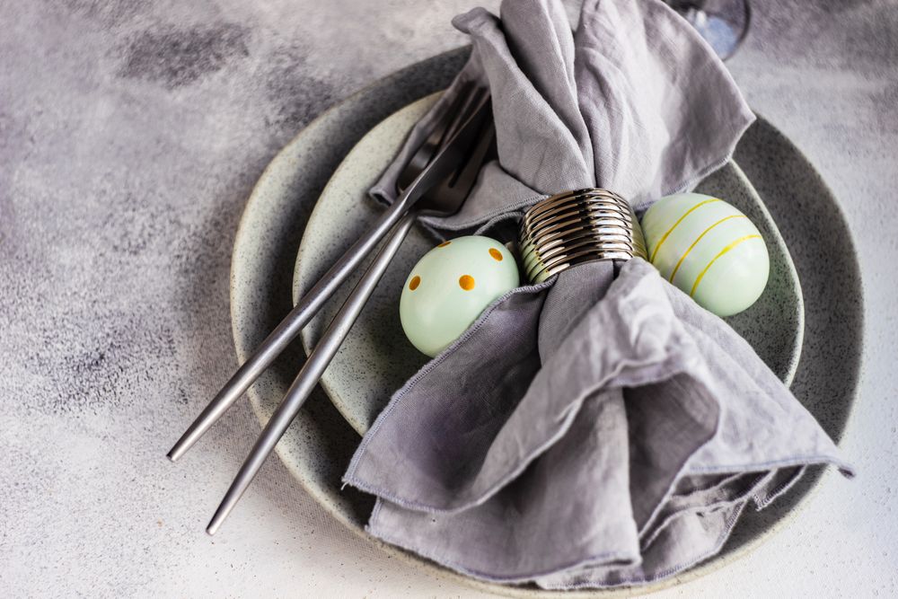 Easter table setting with green decorative eggs