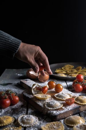 Homemade ravioli made with parmesan cheese, tomato and basil.