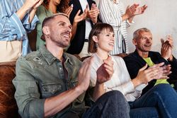 A of people applauding during a speech