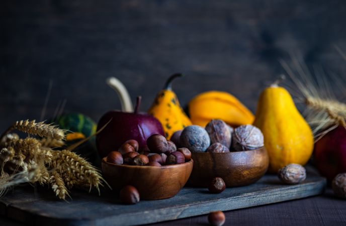 Side view of autumnal foods on wooden table