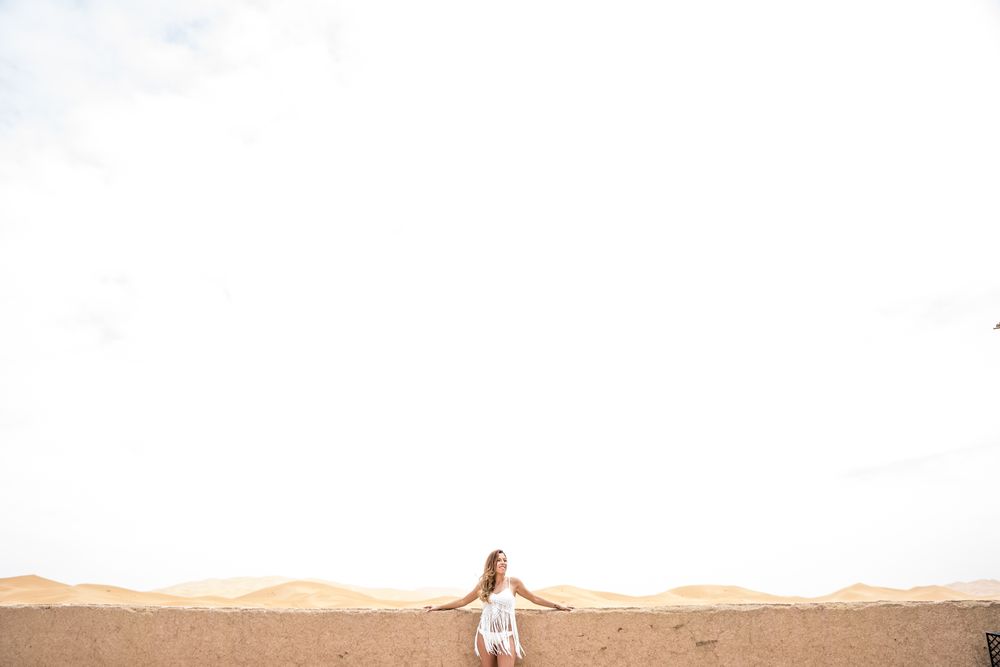 Woman on terrace against desert landscape