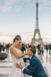 Happy newlyweds in wedding clothing embracing