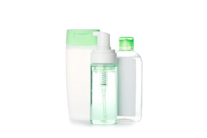 Shower gel, shampoo and scrud isolated on plain background