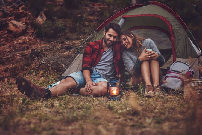 Young couple enjoying a camping holiday together