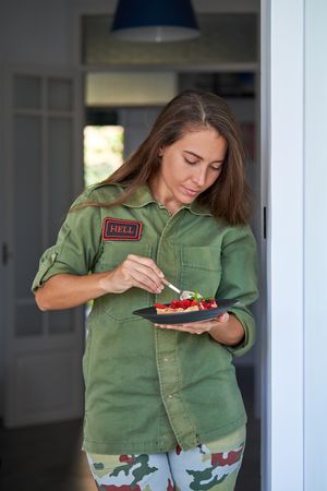 Young woman with plate of cake