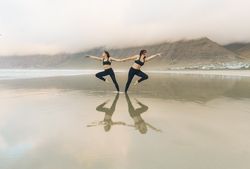 Women exercising near sea