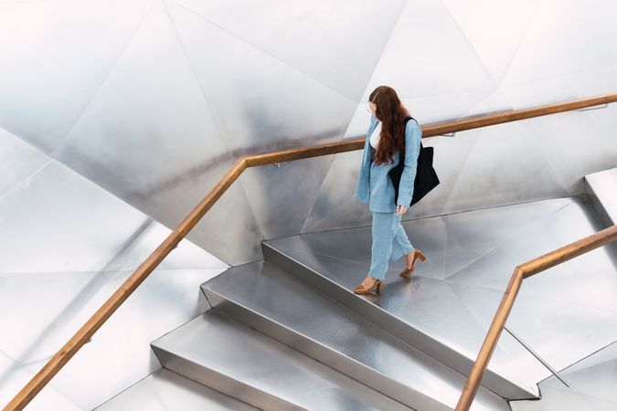Unrecognizable woman walking on stairs