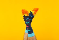 Concept of clothes for legs - socks, socks on male legs