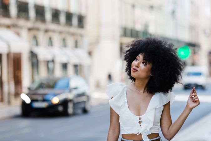 Black female looking at camera in urban background