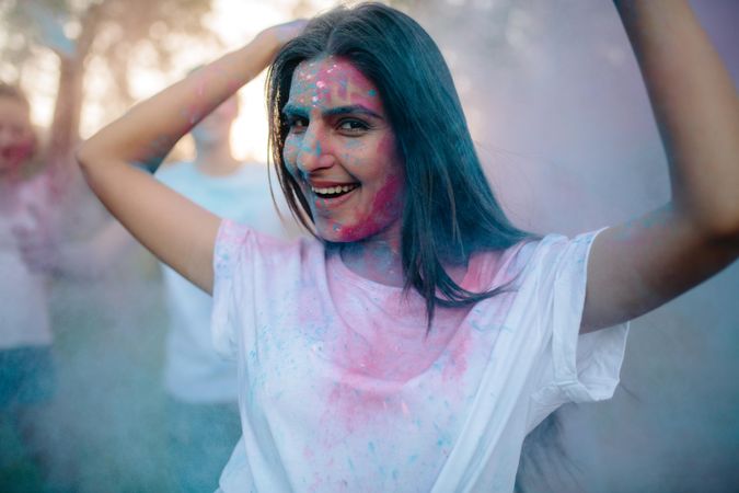 Woman enjoying festival of colors with friends