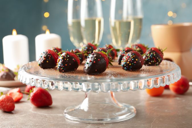 Composition with chocolate fondue on gray table. Delicious sweet food