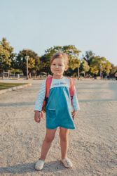 Little girl standing in park