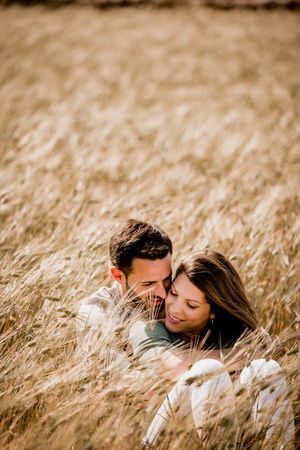 Serene lovers embracing on wheat field