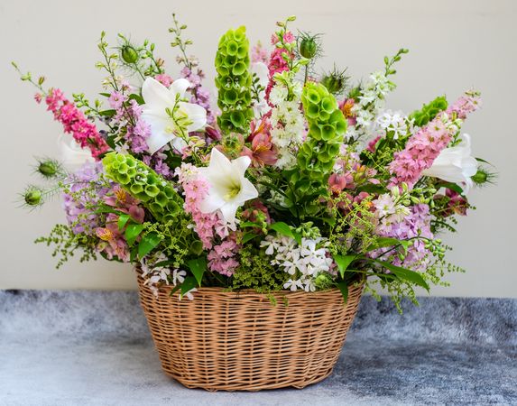 Summer floral composition in basket
