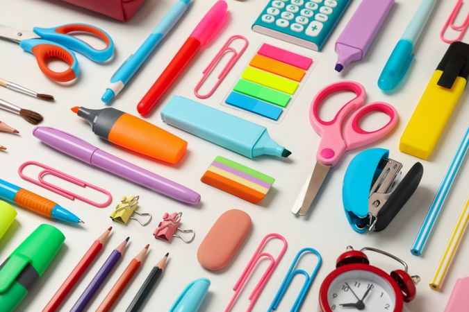 Flat lay with different school supplies on blank background