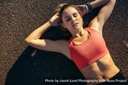 Top view of a woman athlete doing workout lying on ground 5r9LDP