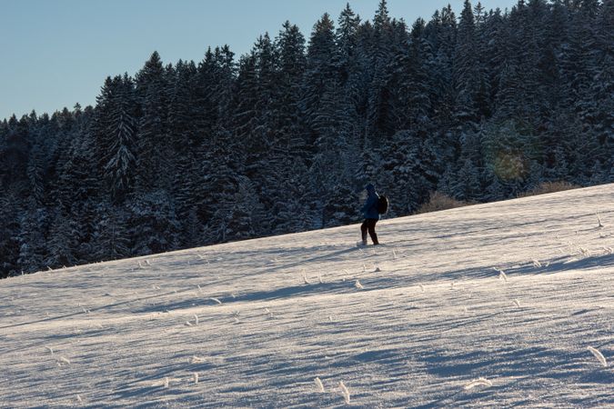Walking through deep snow in the german mountains in