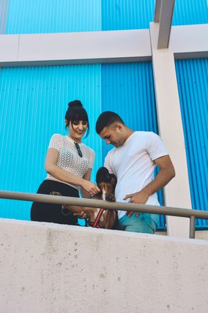 Couple with their Boxer dog.