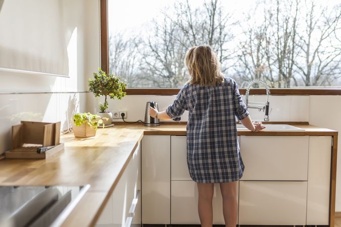 Woman at home in the kitchen