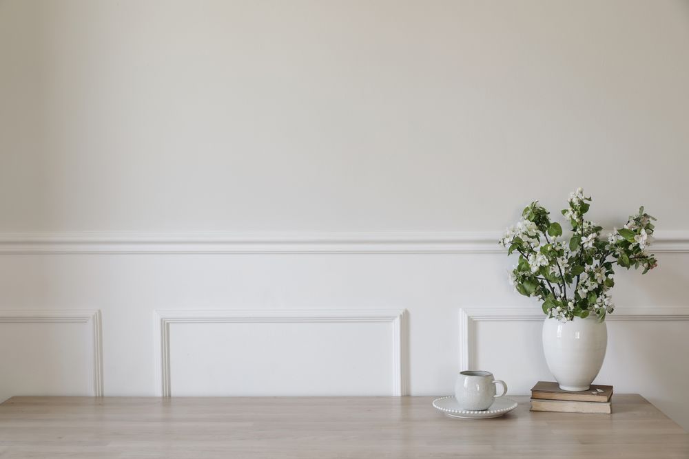 Ceramic vase with blooming apple tree branches