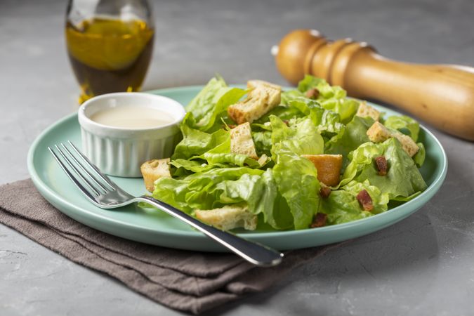 Caesar salad with croutons and bacon.