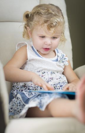 Little Girl Reading Her Book
