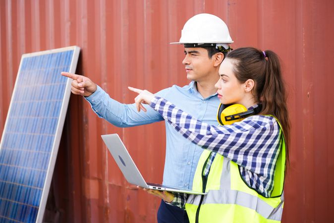 Man and woman planning on construction site