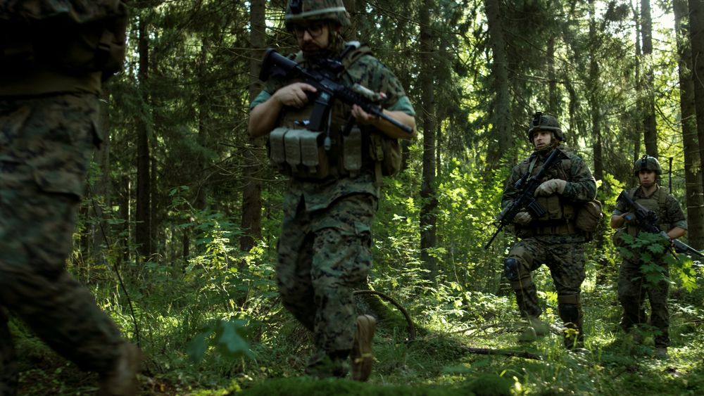 Squad of Five Fully Equipped Soldiers on a Reconnaissance Military Mission.