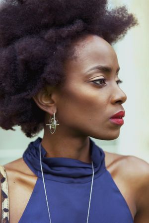 Portrait of Black woman in blue shirt