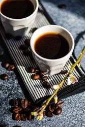 Cups of espresso on counter