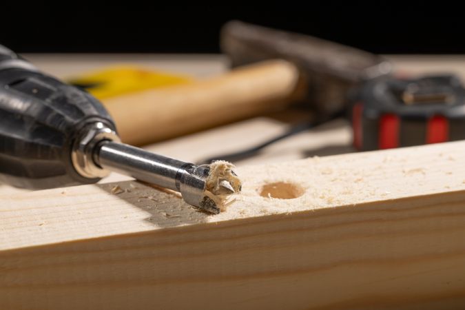Macro drilled hole with drill and shavings