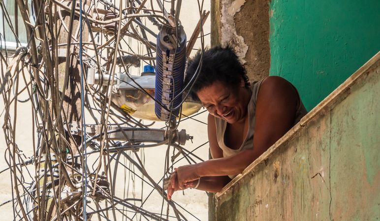 Rio de Janeiro, Brazil - February 13 2014: Laughing woman on shabby balcony