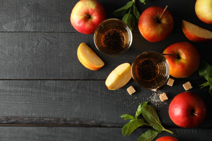 Composition with cider, sugar and apples on wooden background