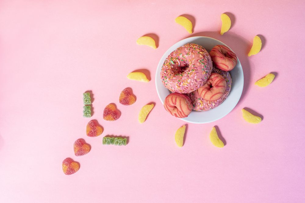 Pink doughnuts in a flower shape made with candies