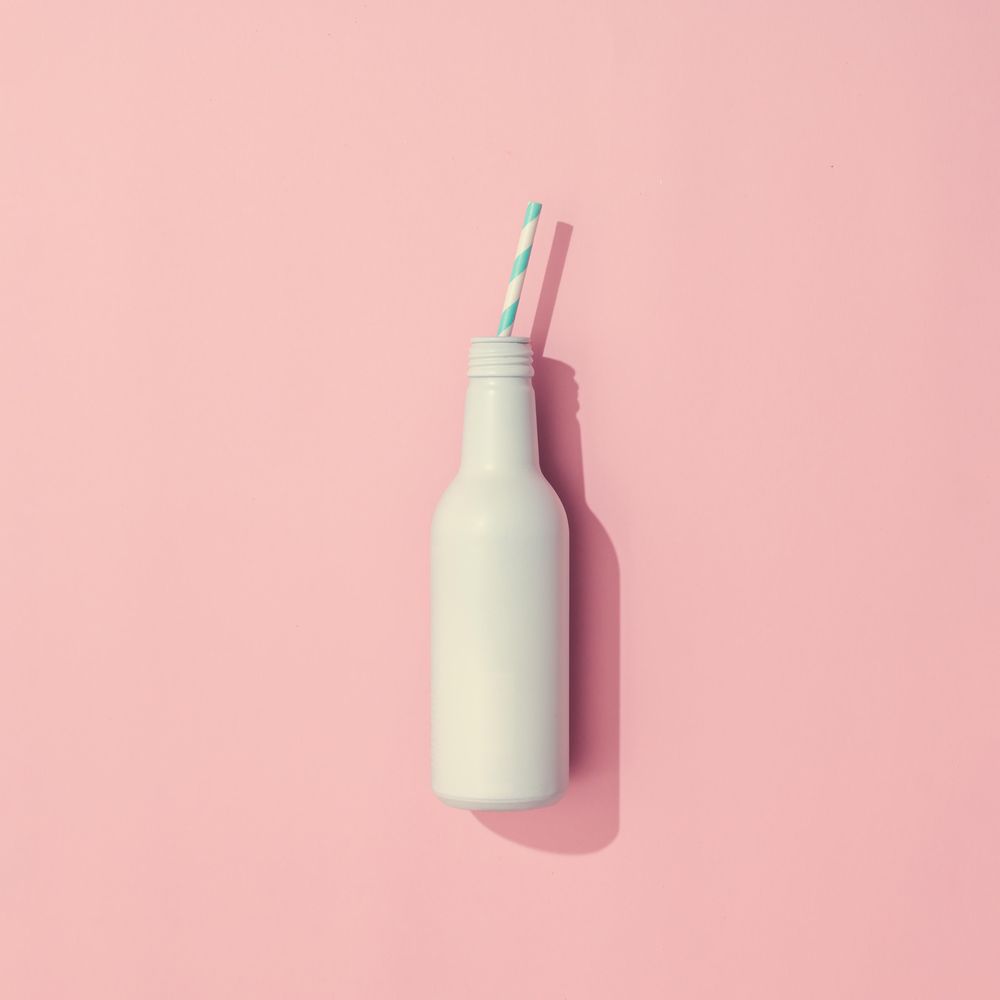 Painted drink on pastel pink background