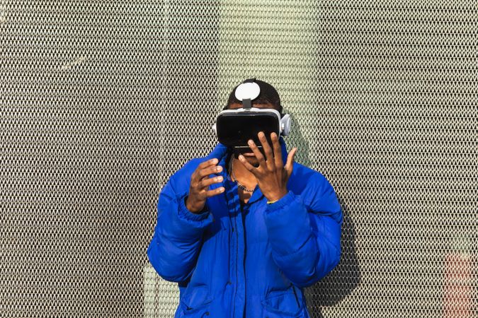 Black man experiencing virtual reality in city