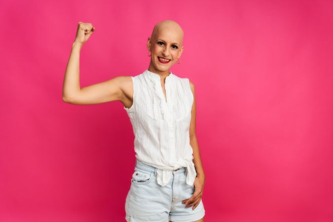 portrait of a woman suffering from breast cancer, with an optimistic gesture of strength and hope
