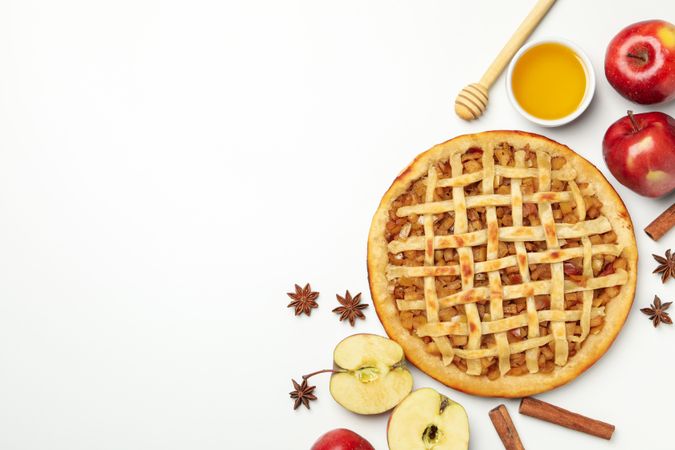 Composition with tasty apple pie on blank background, top view