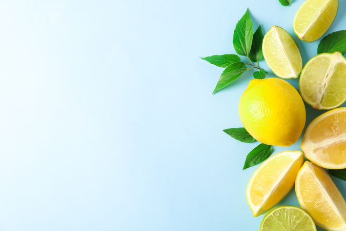 Flat lay composition with citrus on color background, space for text