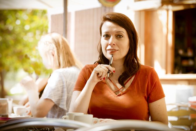 Adult woman thinking at a terrace