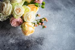 Pastel rose bouquet on grey background