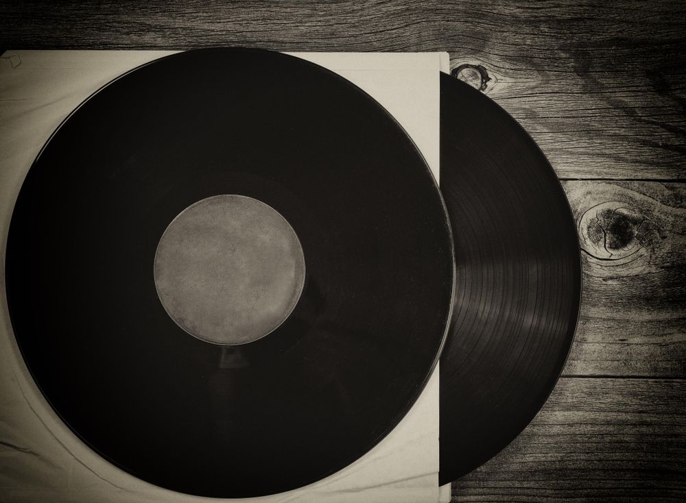 Vintage music records on rustic wood table