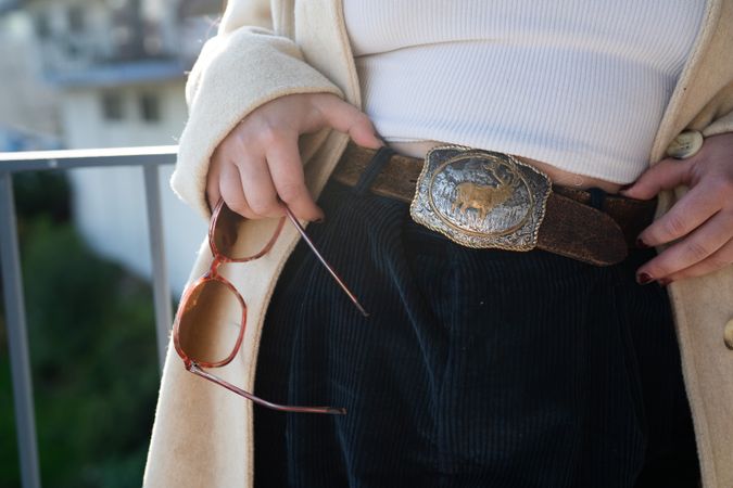 Cropped close up shot of vintage belt buckle with elk