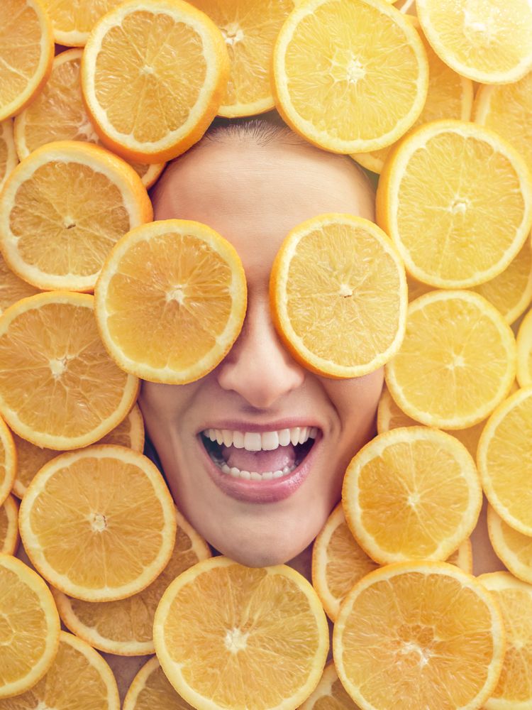 Excited woman in orange pieces