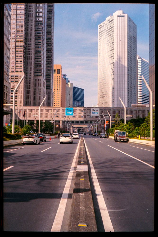 Cars on road near high rise buildings Shinjuku city, Tokyo, Japan